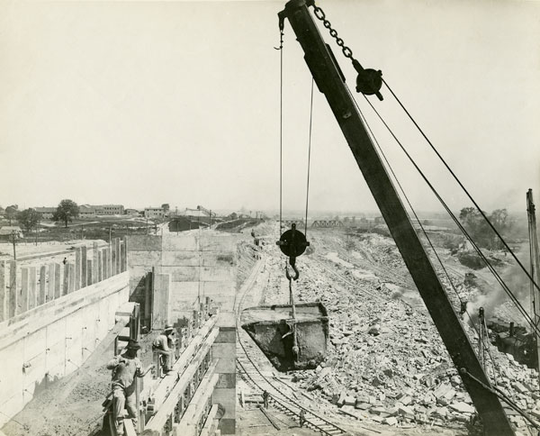 <p>Almost five million barrels of cement (@ 350 lbs. ea.) were required for the concrete locks, weirs, and other structures. Buckets similar to the one shown in this photo would be used in pouring the concrete for the massive monoliths. Photo Credit: Tom R. Lee, St. Catharines Museum, 6666-N</p>